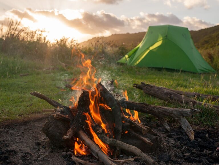 green-tent-and-campfire-at-sunset