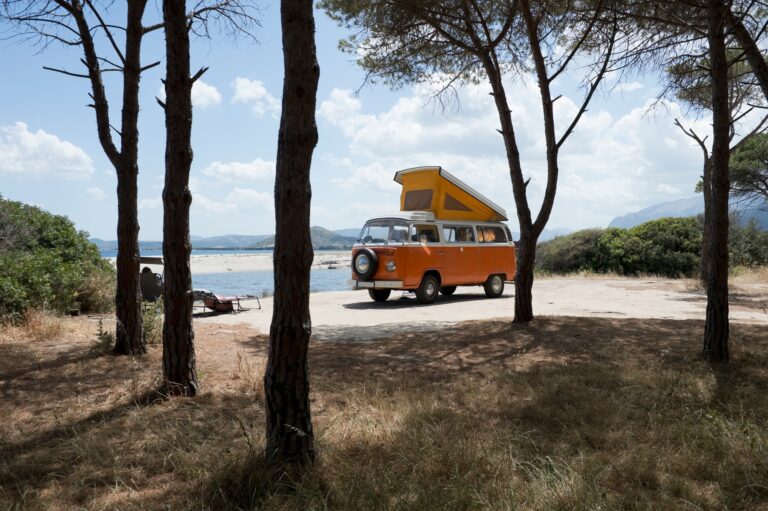 Italy, Sardinia, Posada, man on vacation with an old van